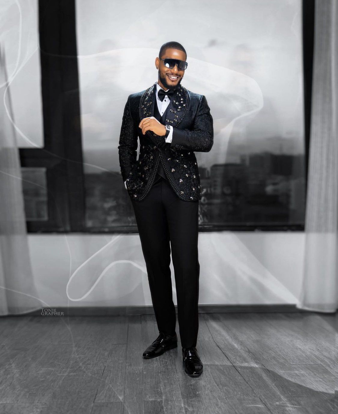 Alex Ekubo's in a black suit, appearing in the list of breathtaking outfits for #AMVCA10